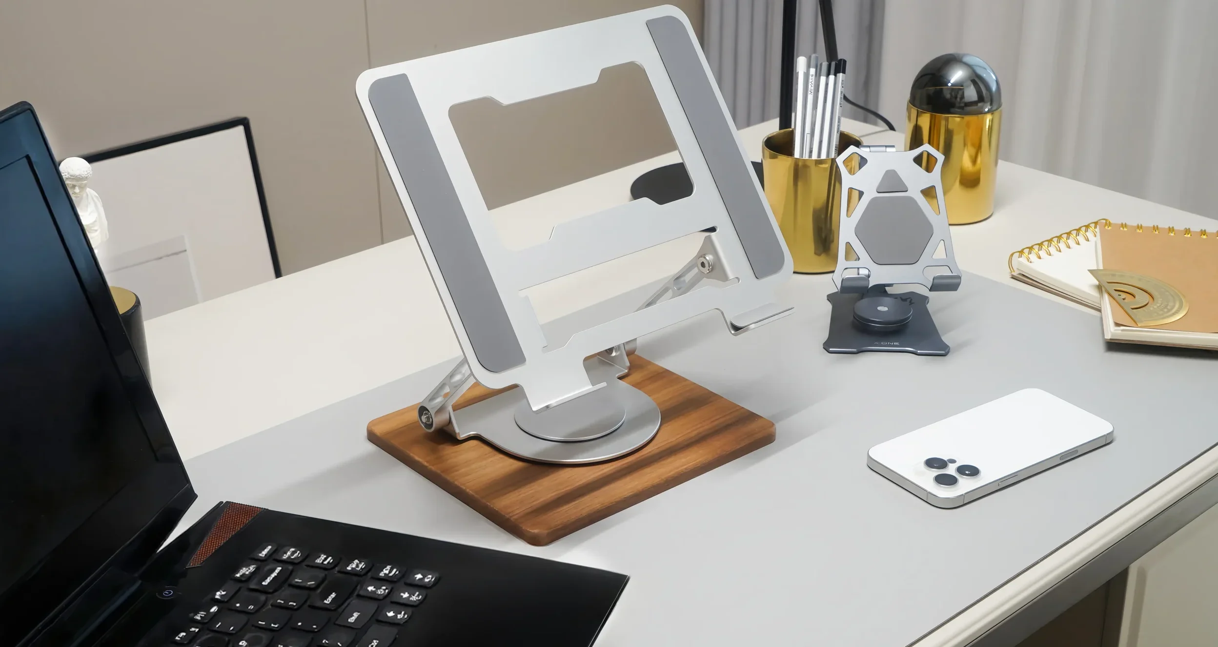 Laptop stand on the desktop.