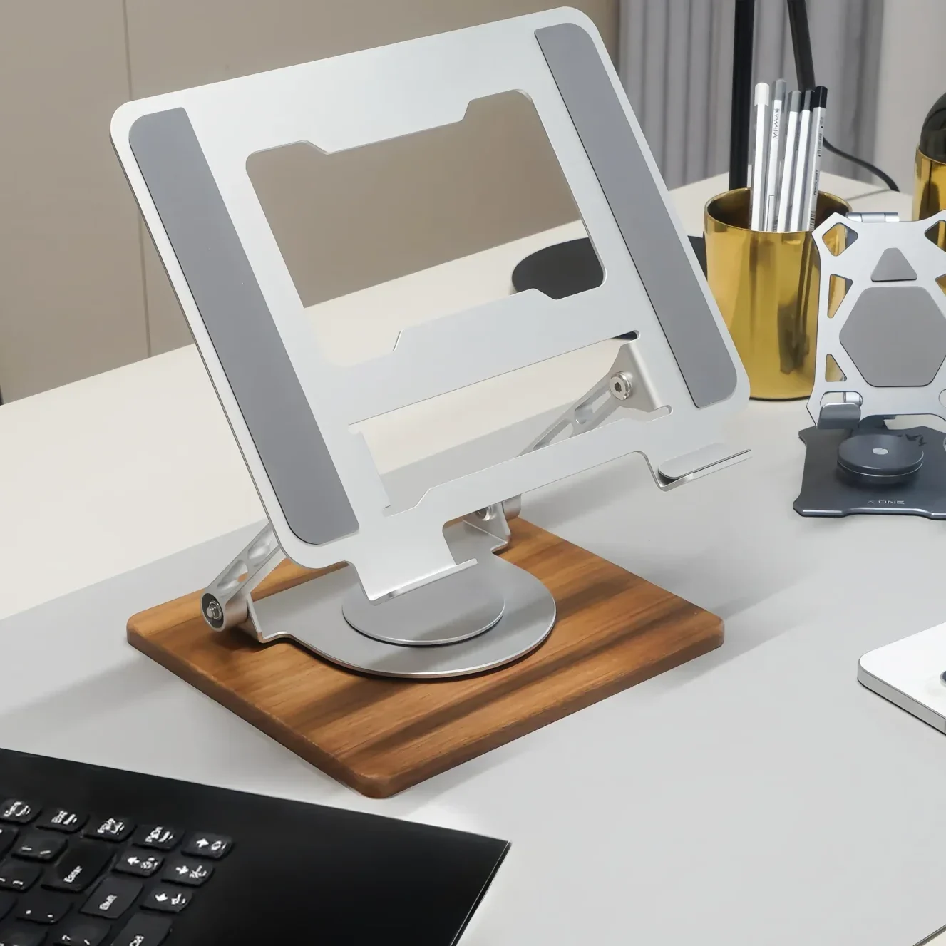 Laptop stand on the desktop.